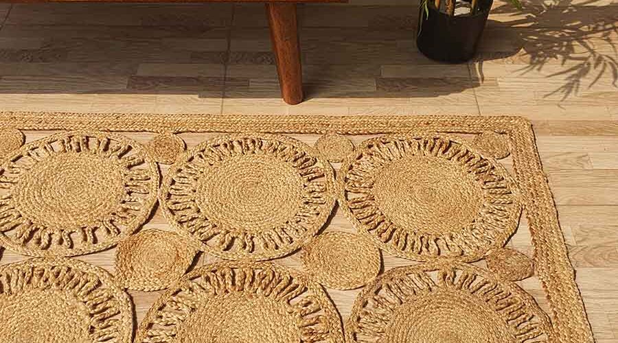 Natural outdoor jute rug placed on a patio with minimalist outdoor decor