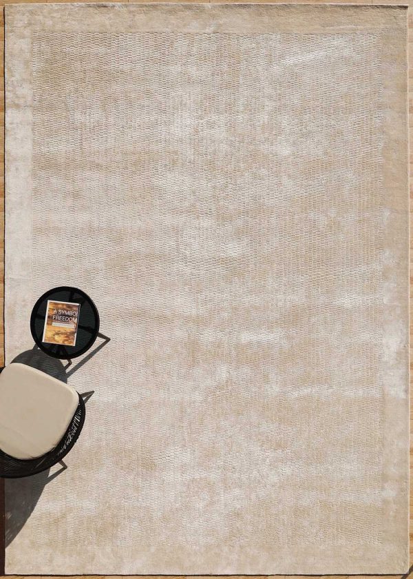 Create a peaceful and inviting atmosphere in your home with this soft beige rug, carefully made by skilled artisans for lasting comfort.