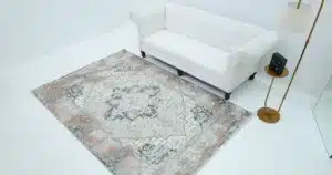 Living room showcasing correct rug placement with furniture arranged for balanced flow