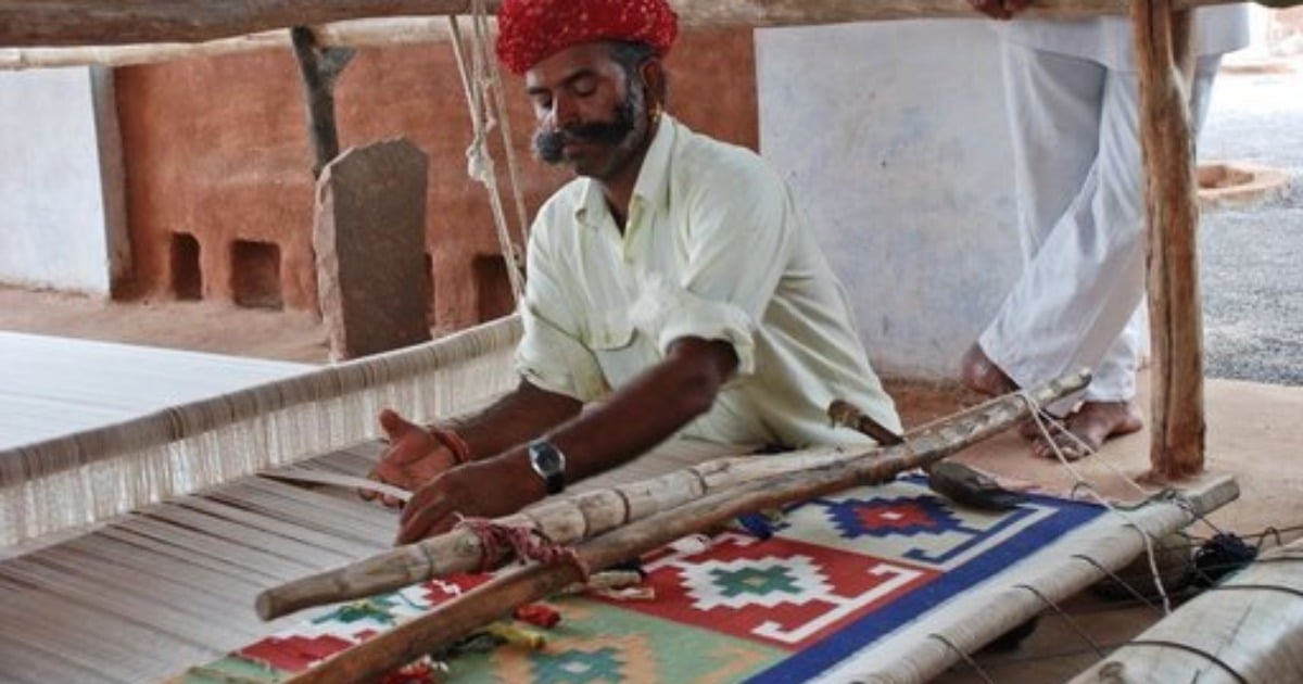 cotton durrie rugs styled in modern living room with geometric design